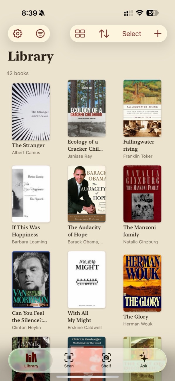 The Library screen: a grid of real book covers with search and grouping